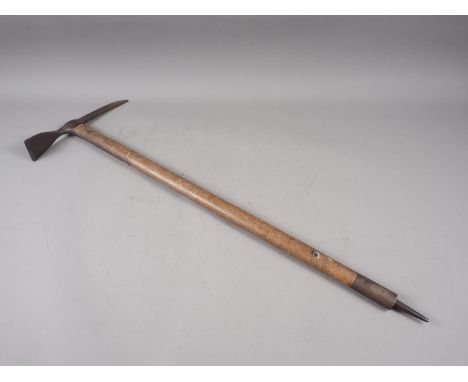 A WWII ice axe, dated 1944, 31 1/2" long 