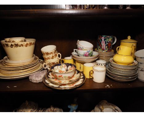 A Balmoral china trio, a pair of Meissen teacups and saucers, decorated with flowers, a Crown Ducal ware yellow glazed part c