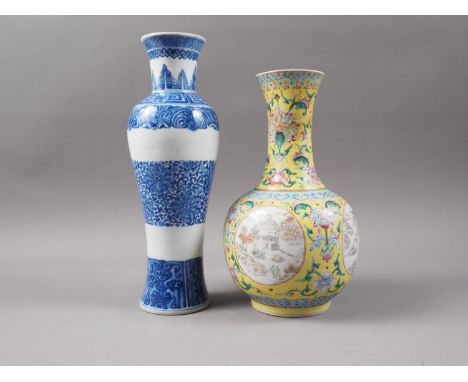 A Chinese 19th century porcelain baluster vase, decorated four landscape panels on a yellow glazed floral ground, seal mark t