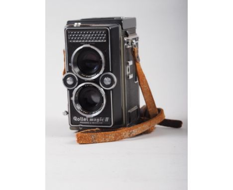 A Rollei Magic II twin lens reflex camera, supplied by Wallace Heaton &amp; Co, in leather case 