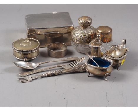 An engine turned silver cigarette box, a silver mounted scent bomb, a silver and cut glass salts jar and various other silver