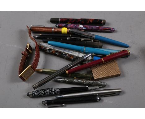 A St Dupont gilt cased cigarette lighter, a number of fountain and other pens, and an Omega wristwatch (as found) 