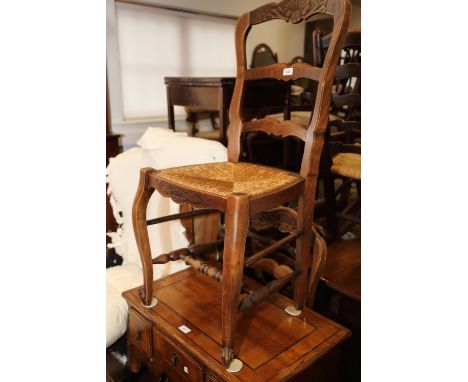 A set of six French polished as walnut rush seat ladder back dining chairs, on cabriole supports 