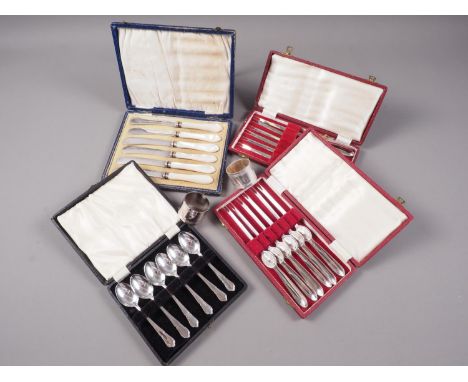 A pair of silver plated napkin rings, in box, a cased set of six mother of pearl handled butter knives, a cased set of six pl