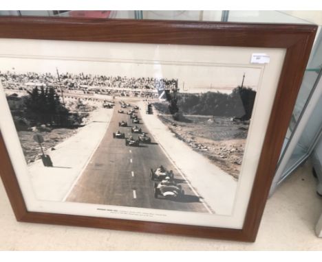 A rare vintage framed and glazed photograph of Stirling Moss - Vanwall - hotly being pursued by Phil Hill, Ferrari, after sta