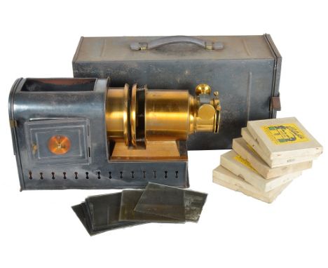 An Edwardian Magic Lantern in Tin Carry Case:Together with numerous plates to include "cross India" with a Kodak 1915-1919. N