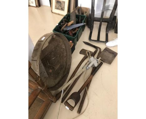 A spade, axe, sieve, lamp and edging shears