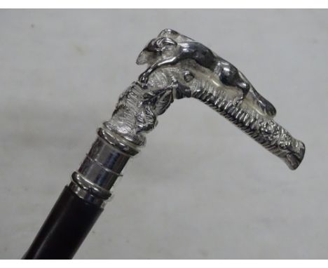 A lady's walking stick with cast metal fox handle.