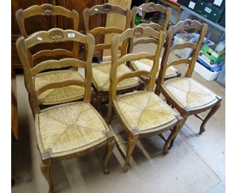 A set of 6 French oak ladder back and rush seated dining chairs.