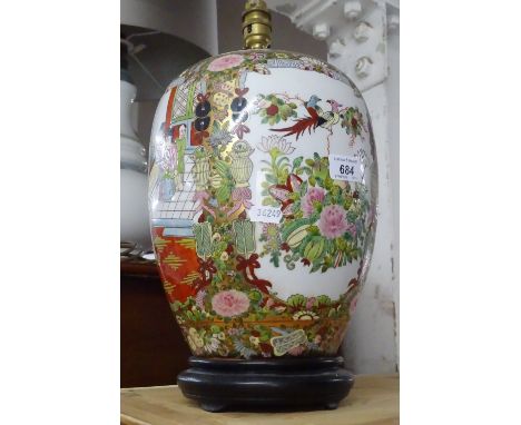 An Oriental ceramic table lamp with polychrome decoration.
