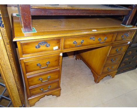 A reproduction yewwood twin pedestal writing desk, width 4'.