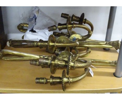 A set of 4 brass twin branch wall light fittings with tassel design.