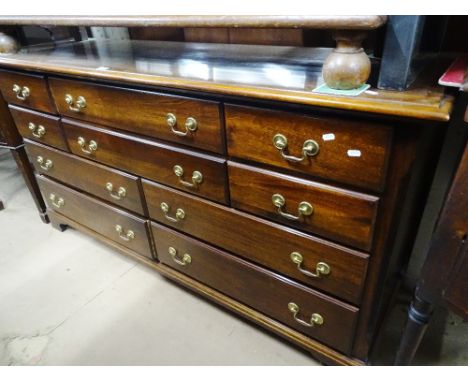 An American mahogany 10-drawer chest, with brass swan neck drop handles raised on bracket feet, by "The Cresent Manufacturing