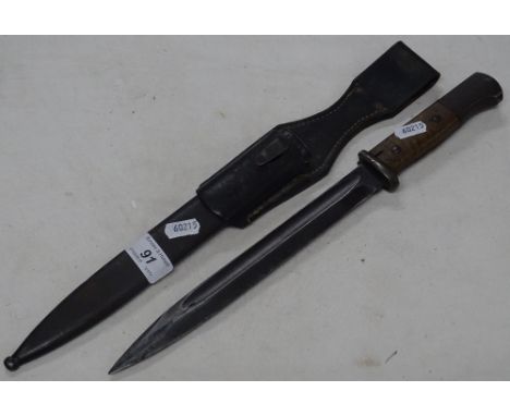 A Second World War German bayonet in scabbard.