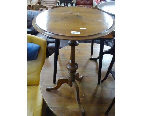 A Victorian mahogany wine table on tripod base, width 1'6", height 2'6".