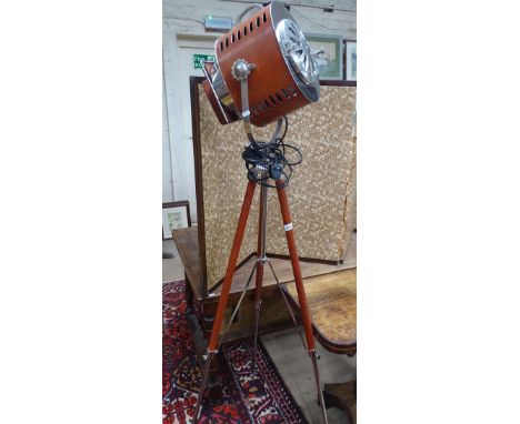 A reproduction chrome and leather covered search/spot light on telescopic stand.