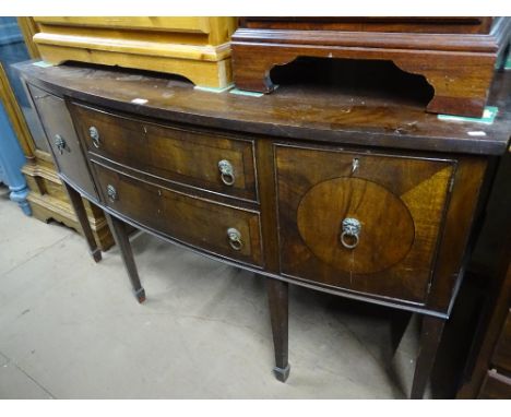 An Antique crossbanded mahogany bow front sideboard, with fitted drawers and cupboards, raised on 6 square tapered legs with 