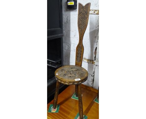 An Arts &amp; Crafts carved beech spinning stool by Ben Setter, (Potnes).