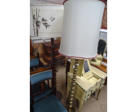 A brass bobbin turned standard lamp and shade and a hardwood open twist standard lamp