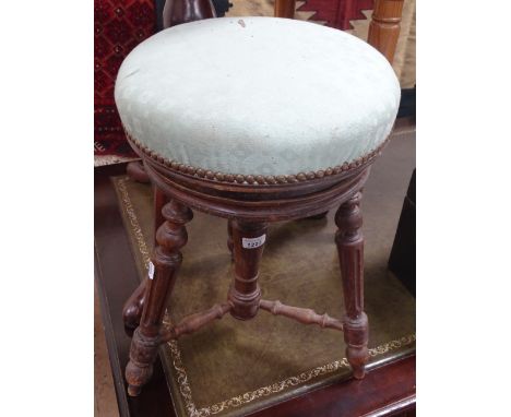 A Victorian revolving piano stool.