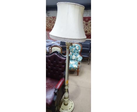 A cream painted and gilded fluted standard lamp and shade.