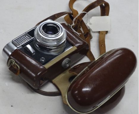 Leather cased Voigtlander camera.