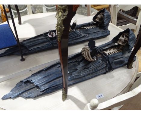 Pair of skeleton design light fittings.