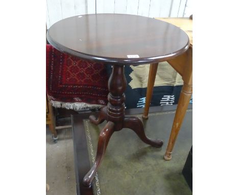 An Antique mahogany wine table with tripod base, width 2', height 2'5" (later top).