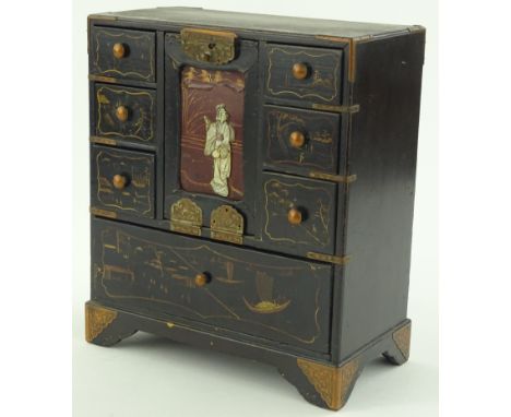 A small Japanese lacquer table cabinet circa 1900, central panel with mother of pearl and ivory inlaid figure and brass mount