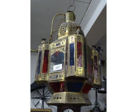 A Moroccan design brass and coloured glass ceiling lantern.