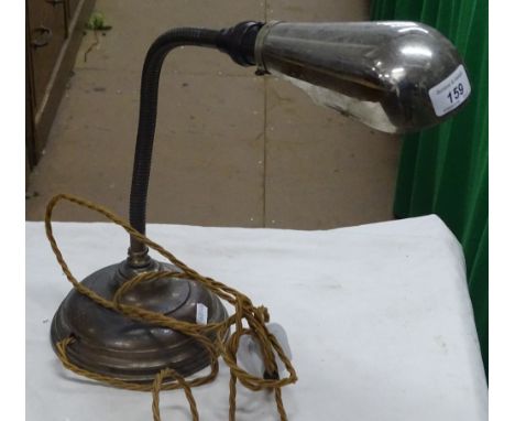 An adjustable Art Deco copper desk lamp with chromium plated shade.