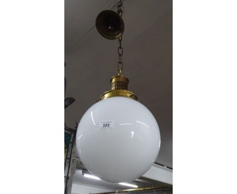 Brass hanging lantern with globular white glass shade.