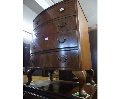 A walnut bow front 4-drawer chest, width 2'1", height 2'7".