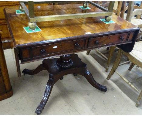 A Regency mahogany sofa table, with 2 frieze fitted drawers, turned centre column and sabre leg, width 2'10" extending to 4'5