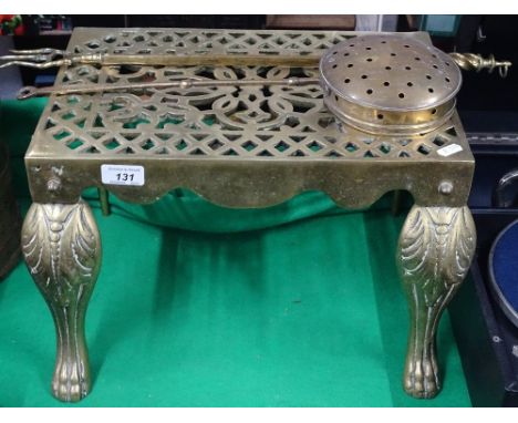 A brass footman, chestnut roaster and toasting fork.