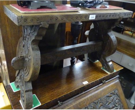 An Antique continental carved hardwood stool/bench, length 2'3", height 1'6".