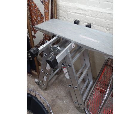 An aluminium 4-folding adjustable ladder and a platform model no. 7618.