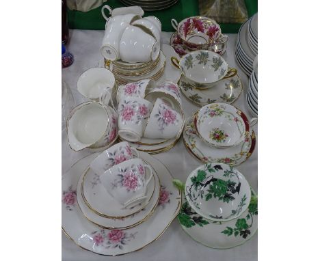A Duchess teaset, and another, and Shelley soup bowls and saucers.