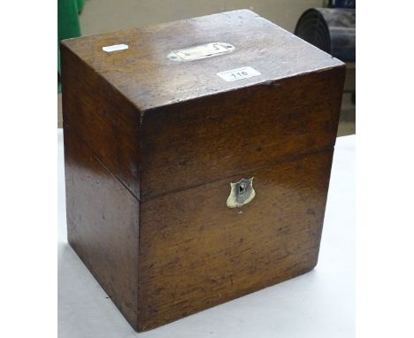 An oak decanter box with brass carrying handle.