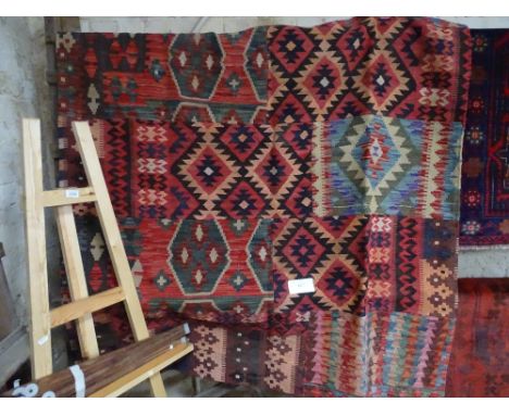 A large multi-coloured patch work Kelim, 146cm x 203cm.