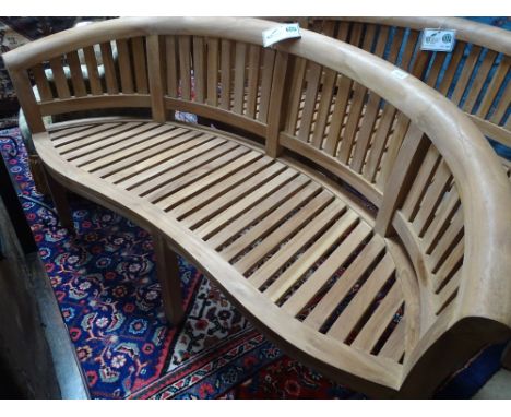 A new Indonesian hardwood bow back garden bench.