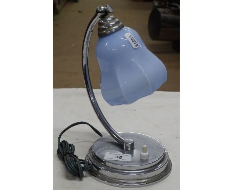A small Art Deco chrome table lamp with blue glass shade.