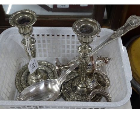 Pair of silver plated candlesticks, sugar casters, stuffing spoon, salts, etc.