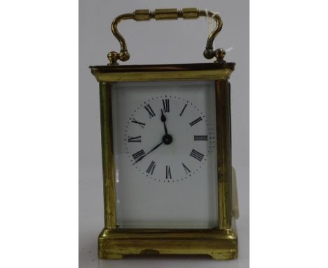 A small French brass cased carriage clock with enamel dial, height 4.25"