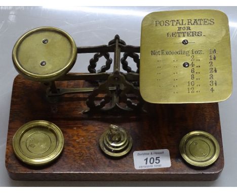 A set of Victorian brass postal scales and weights, width 9"