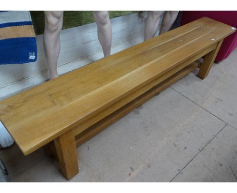 A solid oak bench seat, L 180cm