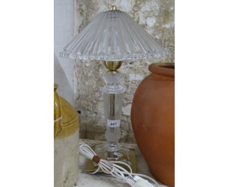 A frosted and clear glass table lamp and shade