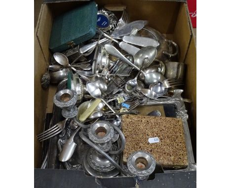 A box containing a large quantity of plated cutlery, serving trays, candelabra