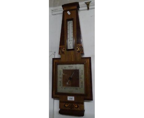 An Art Deco wall barometer in inlaid case
