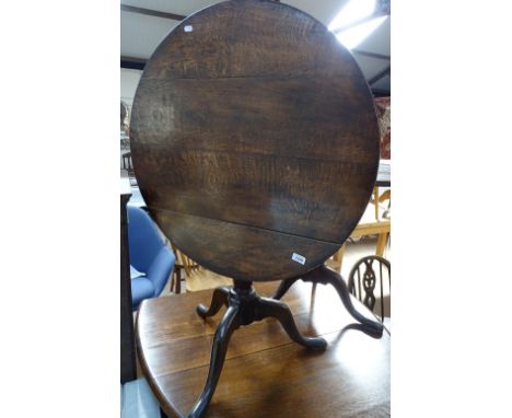 A George III oak tilt-top tripod table with birdcage movement